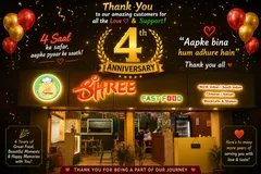 Shree Fast Food storefront lit up for its 4th anniversary